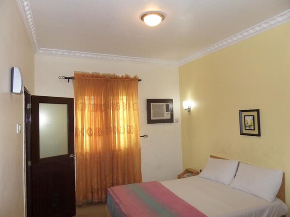 Desk, laptop workspace, bed sheets