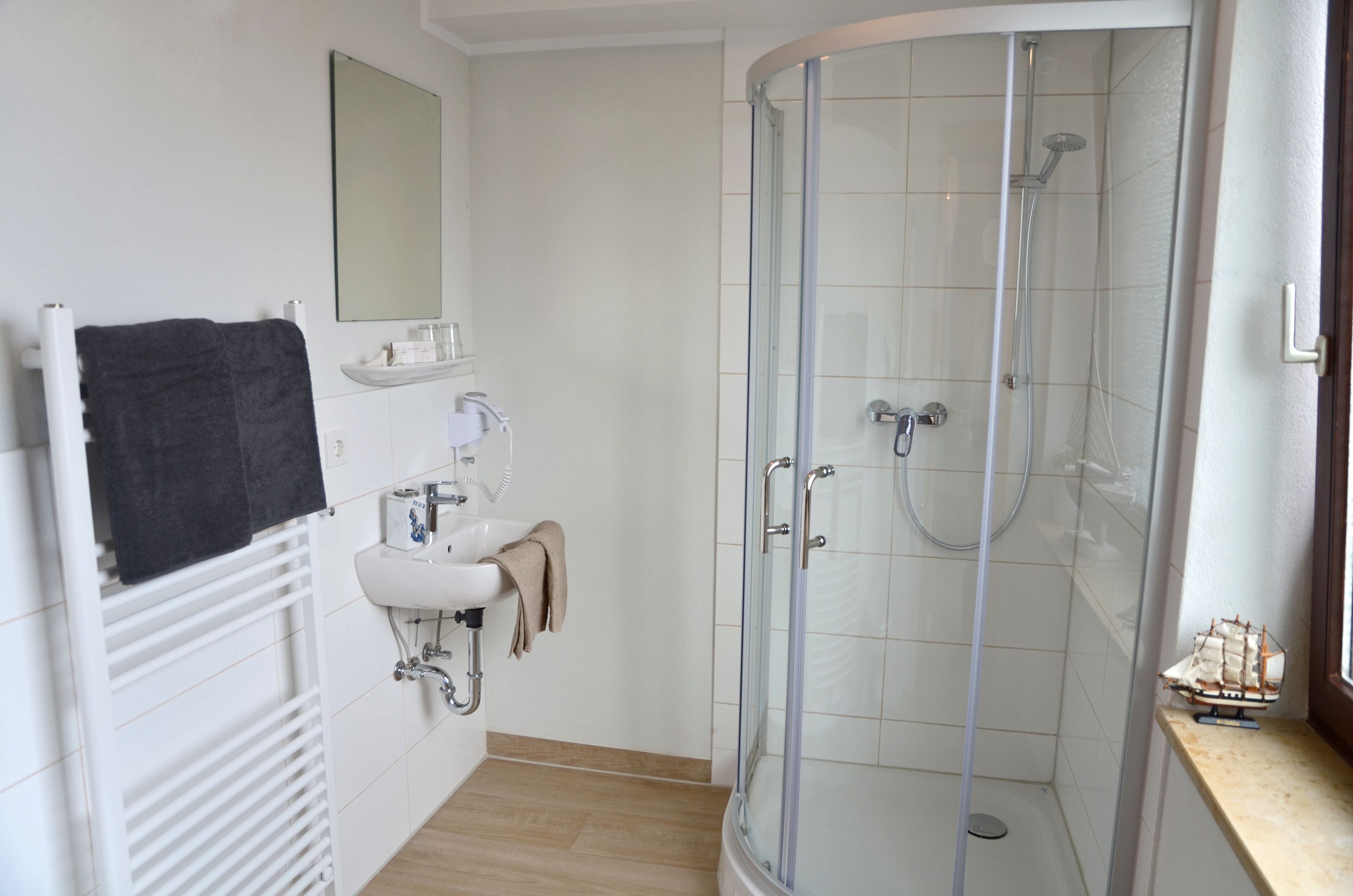 shower, free toiletries, hair dryer, towels