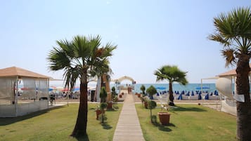 On the beach, free beach shuttle, sun loungers, beach umbrellas