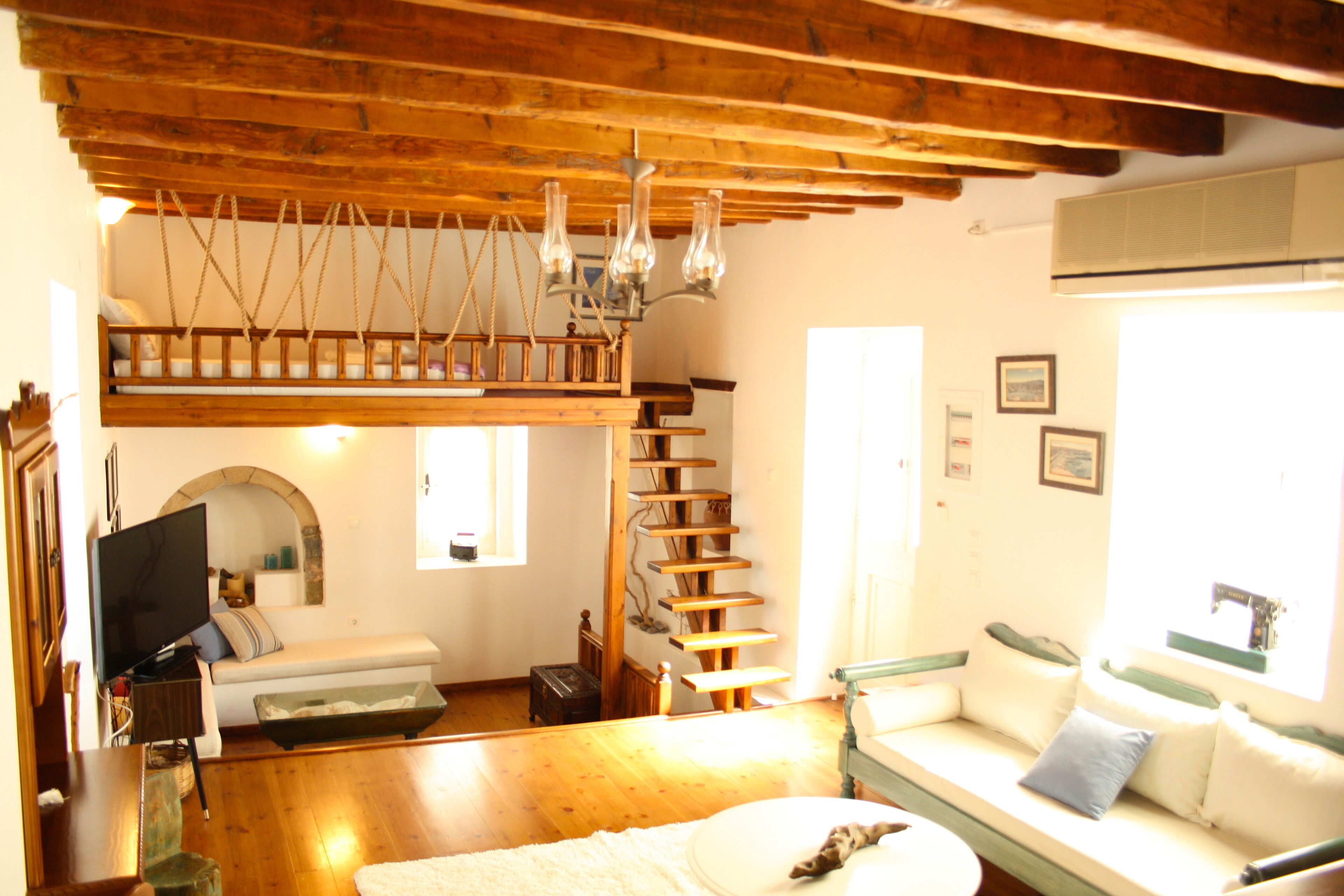 Family Suite | Living area | 24-inch flat-screen TV with cable channels, TV, DVD player