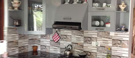 Deluxe Room, 1 Bedroom, Smoking, Garden View | Private kitchen | Shared fridge, electric kettle, highchair