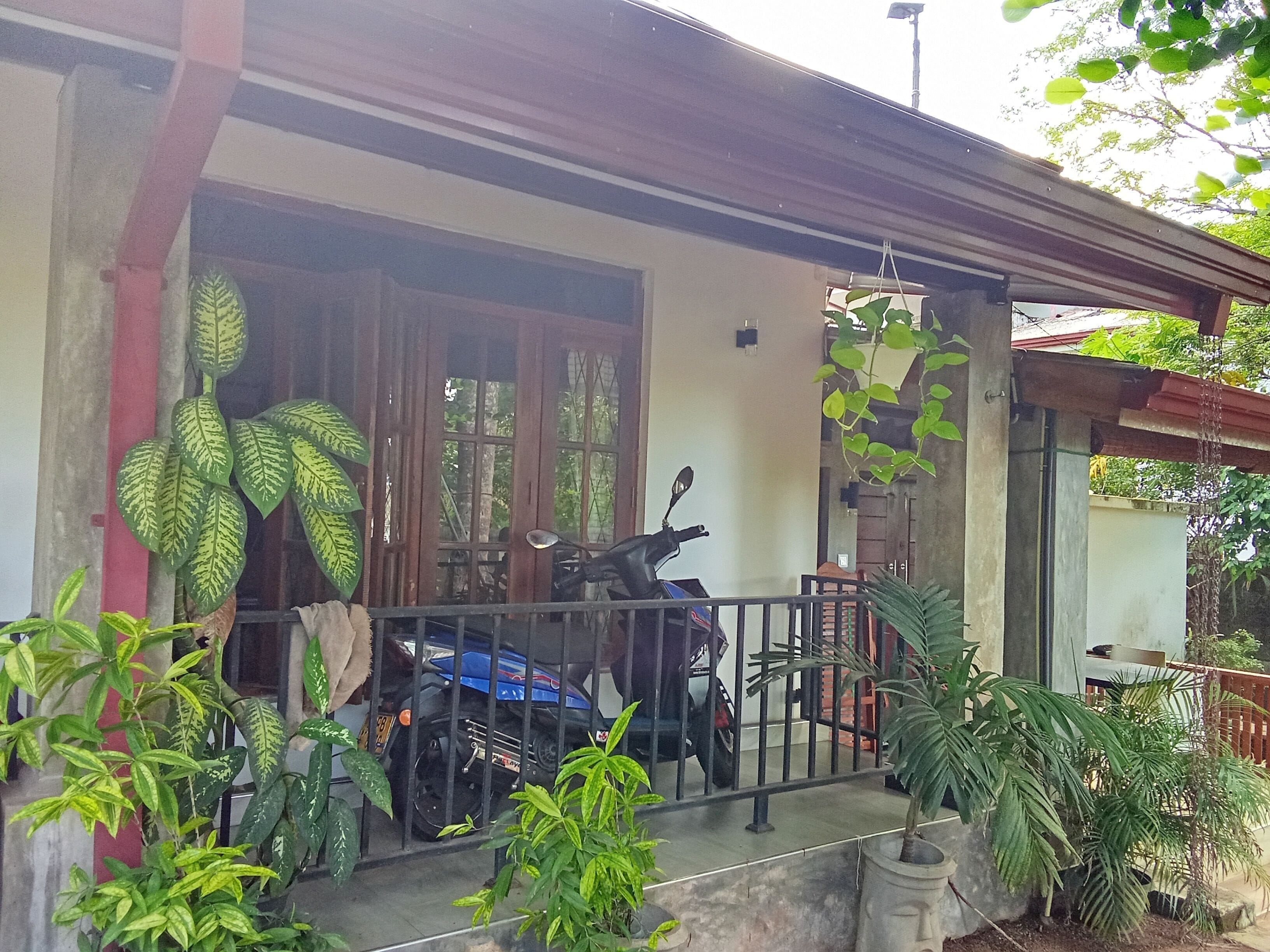 Deluxe Room, 1 Bedroom, Smoking, Garden View | 1 bedroom, in-room safe, desk, iron/ironing board