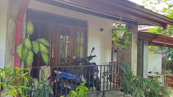 Deluxe Room, 1 Bedroom, Smoking, Garden View | 1 bedroom, in-room safe, desk, iron/ironing board