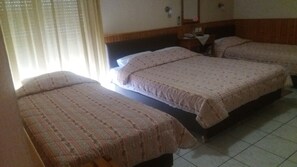 Standard Triple Room, Partial Sea View | Iron/ironing board, bed sheets
