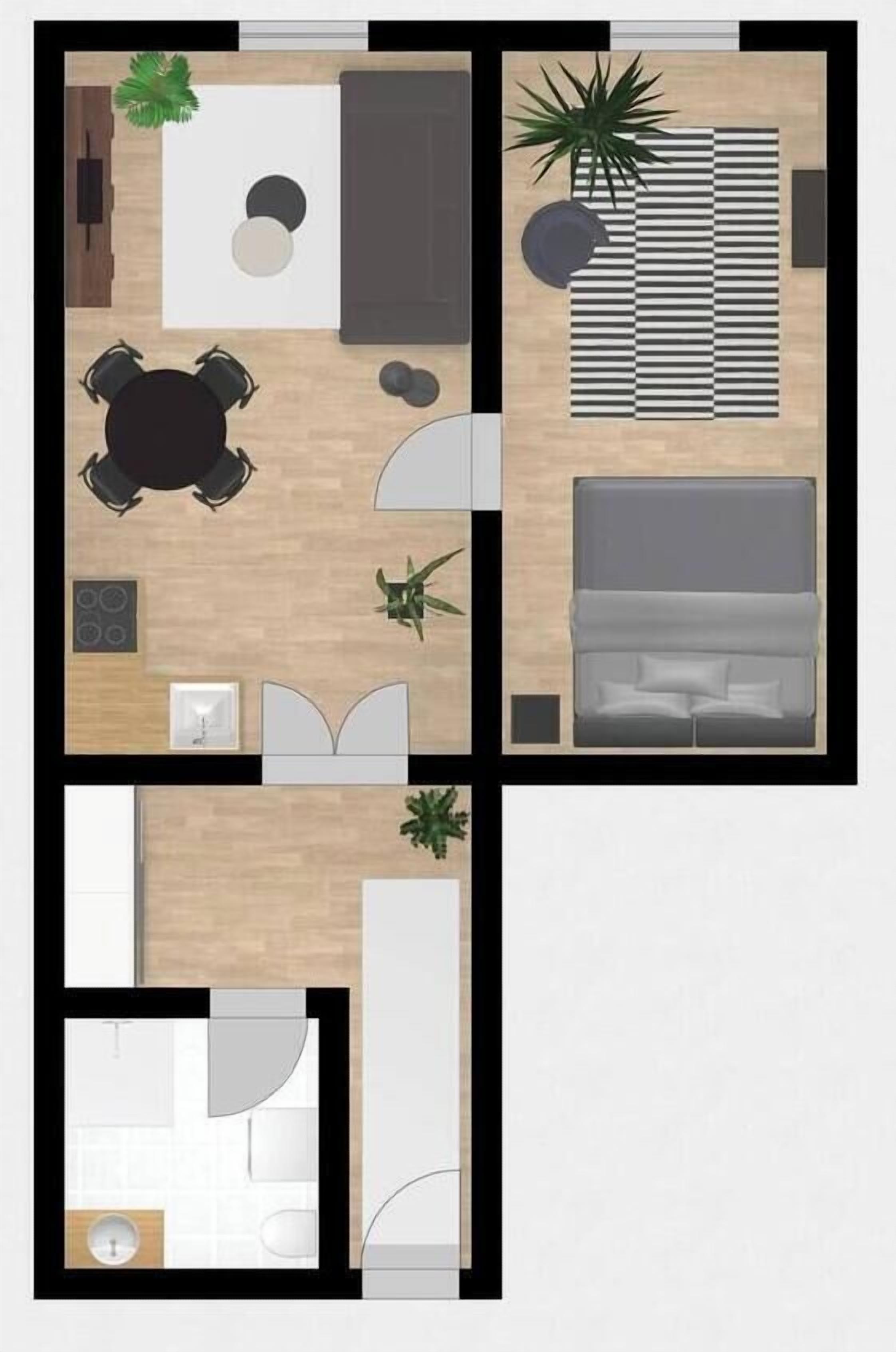 Un hôtel à deux étages comprenant un espace repas, un salon, une chambre et une salle de bain.
