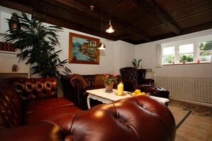 Family Apartment, 2 Bedrooms, Fireplace | Living area | 55-inch flat-screen TV with cable channels, TV, toys - Køge Bed and Kitchen-Apartment (Koge)