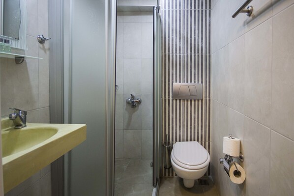 A bathroom with a sink, toilet, and shower. - Bestur Hotel (Istanbul)