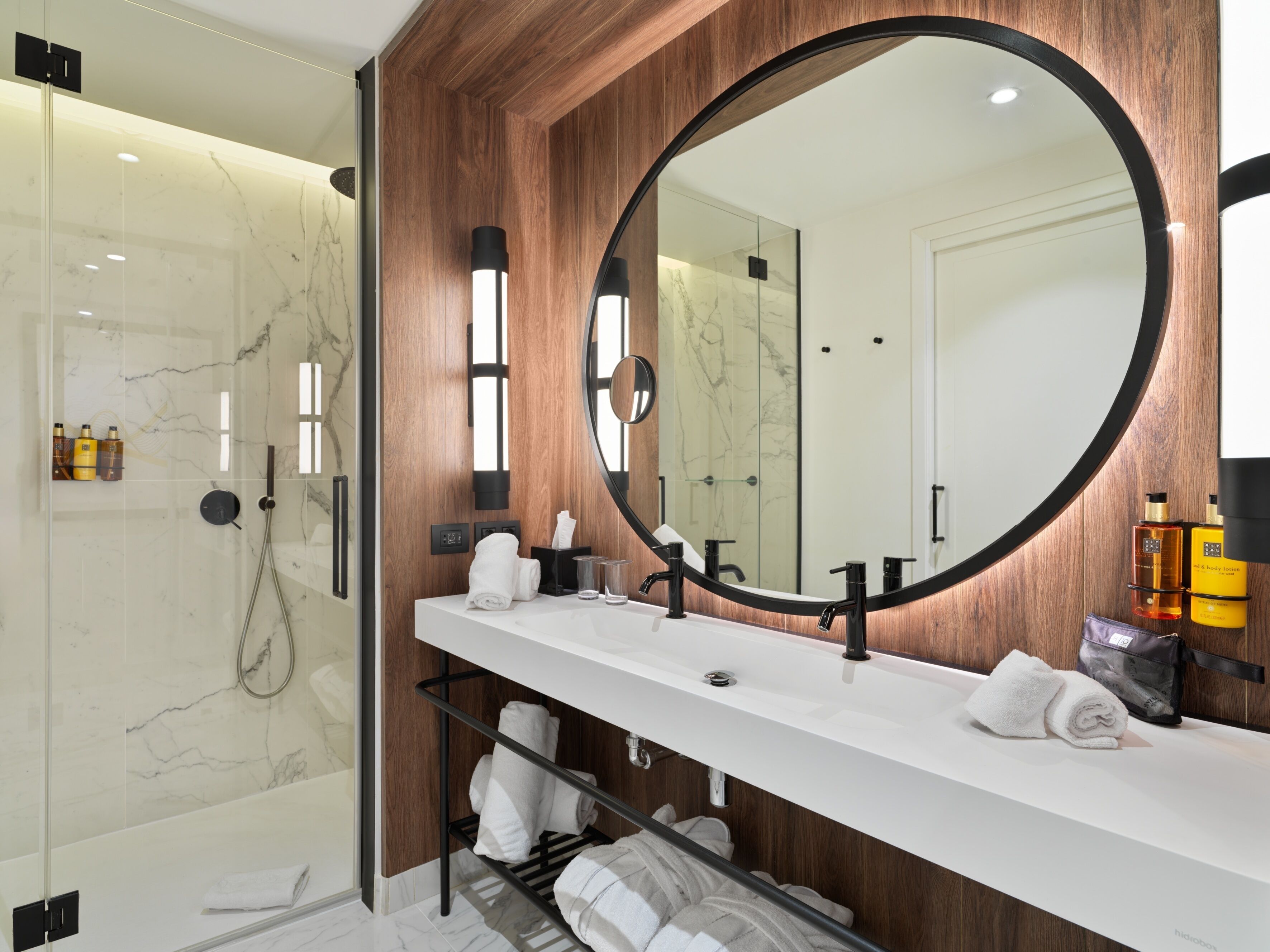 shower, designer toiletries, hair dryer, towels