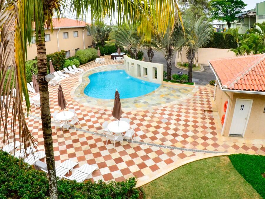 Outdoor pool, open 8 AM to 8 PM, pool loungers