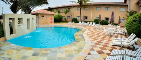 Outdoor pool, open 8 AM to 8 PM, pool loungers