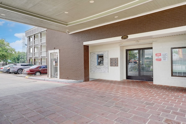 A building entrance with a brick facade, a door, and a mailbox. - Memphis 1 Extended Stay near airport I 240, TN (Memphis)