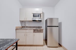 Premium Room, 1 King Bed, Accessible, Kitchenette | Private kitchenette | Mini-fridge, microwave, coffee/tea maker, dining tables - Memphis 1 Extended Stay near airport I 240, TN (Memphis)