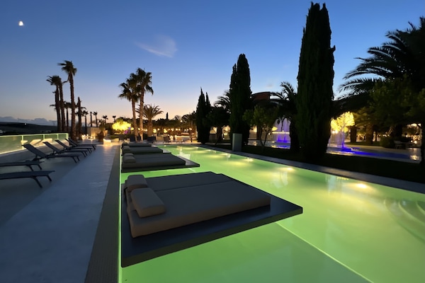 Seasonal outdoor pool, open 10:00 AM to 7:00 PM, pool umbrellas