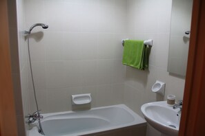 Bathtub, hair dryer, towels