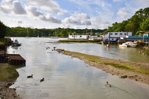 A calm river with boats, ducks, and a small dock. - Two Bedroom/Two Bathroom. Tranquil and Conveniently Situated. (Wootton Bridge)