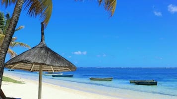 On the beach, sun-loungers, beach towels