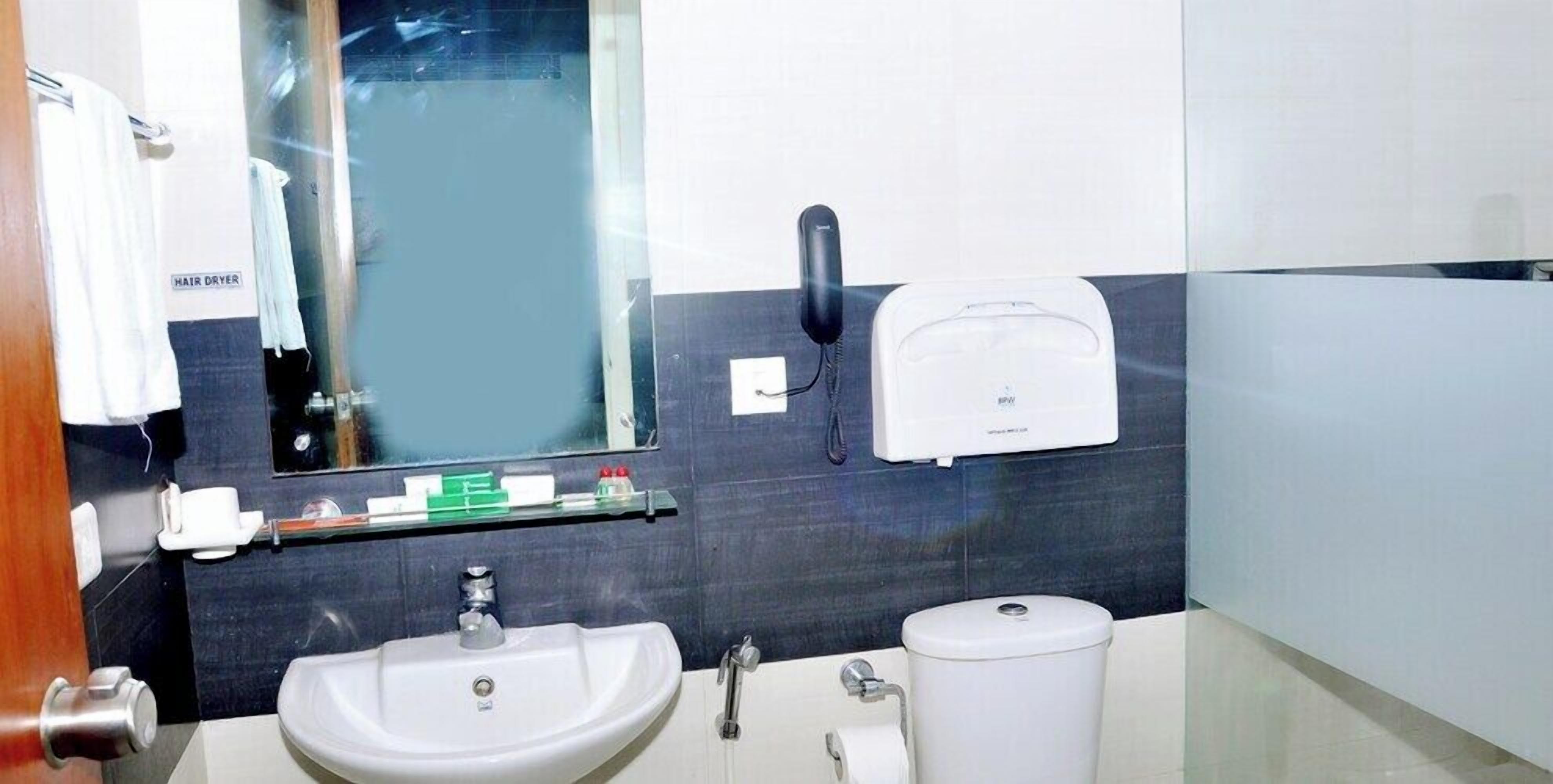 Shower, rainfall showerhead, bathrobes, towels