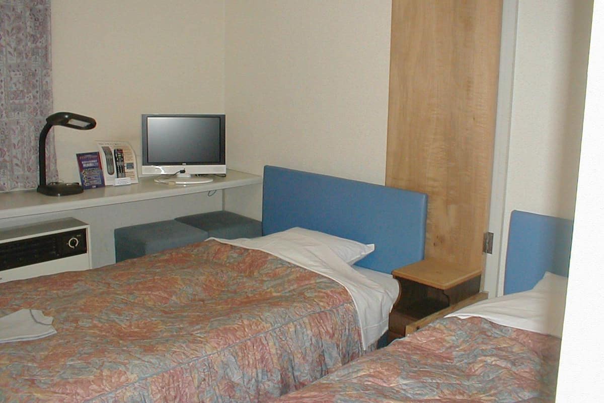 Habitación con 2 camas individuales | Wifi gratis y ropa de cama