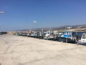 A concrete dock with several boats moored alongside. - Modern 2 bed apartment situated in the Universal Area of Paphos (Paphos)