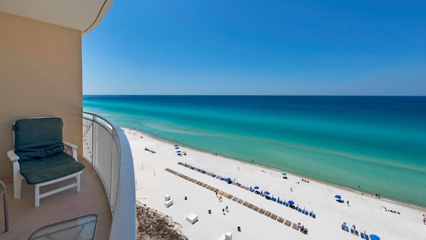A balcony with a view of a beach and ocean. - 1105 - 2BR/2BA Coastal Gulf Views (Panama City Beach)