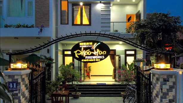 A modern building with a sign for "Rhoo Poa Fireworks" indicating a business or event space. - Fireworks Homestay (Da Nang)