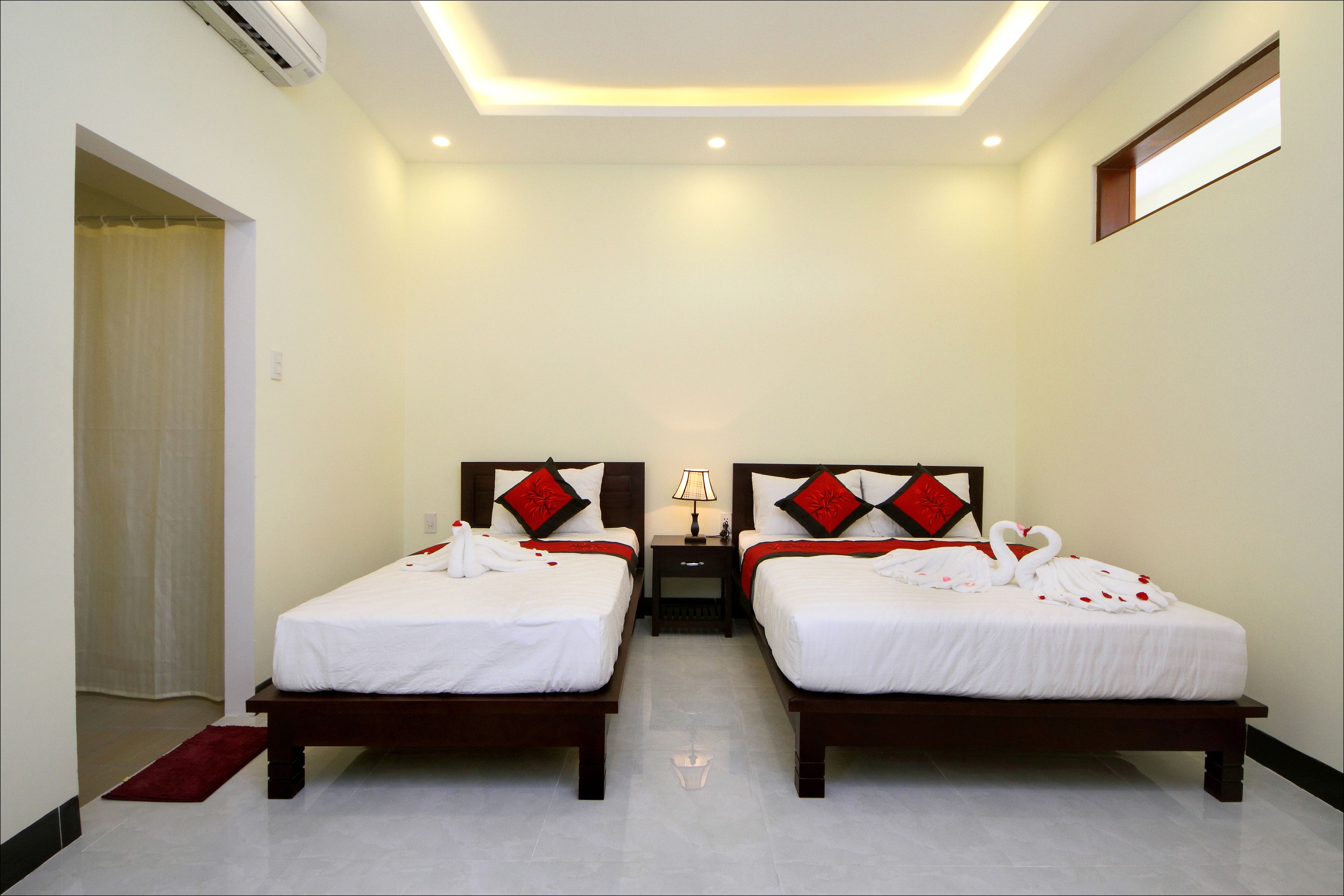 Triple Room, Balcony | Memory foam beds, minibar, desk, blackout drapes