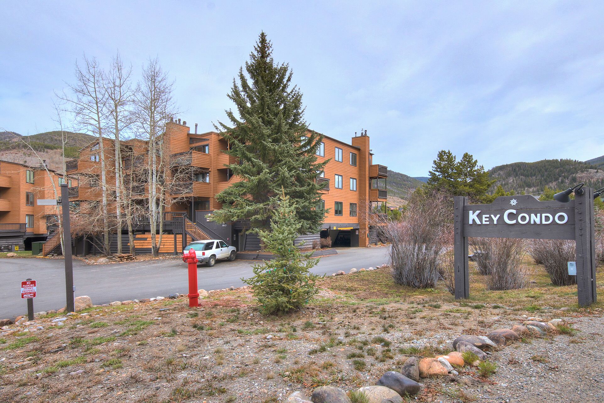 A multi-story building with a sign reading "Key Condo".