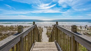 A wooden boardwalk leading to a beach with a clear sky. - BEACHFRONT 1st Fl Walkout, Crystal Beach, Water Views, FREE Beach Setup, Pool/HotTub - Emerald Dunes (Destin)