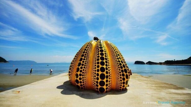 A beach scene with a large, spherical structure with a pattern of holes. - Next International Homestay (Takamatsu)