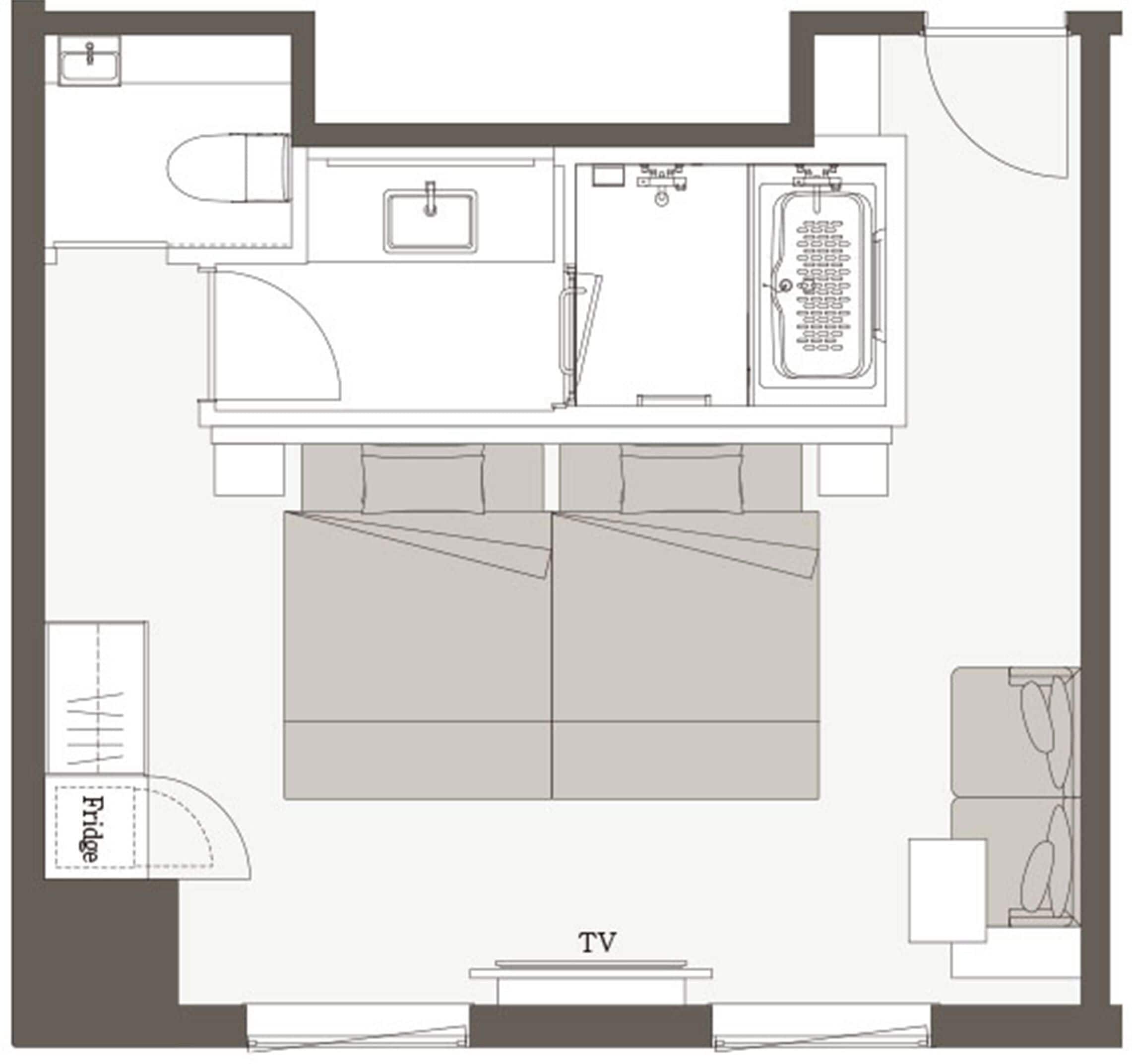 A floor plan of a hotel room with a TV, a bed, a small bathroom, and a kitchenette.