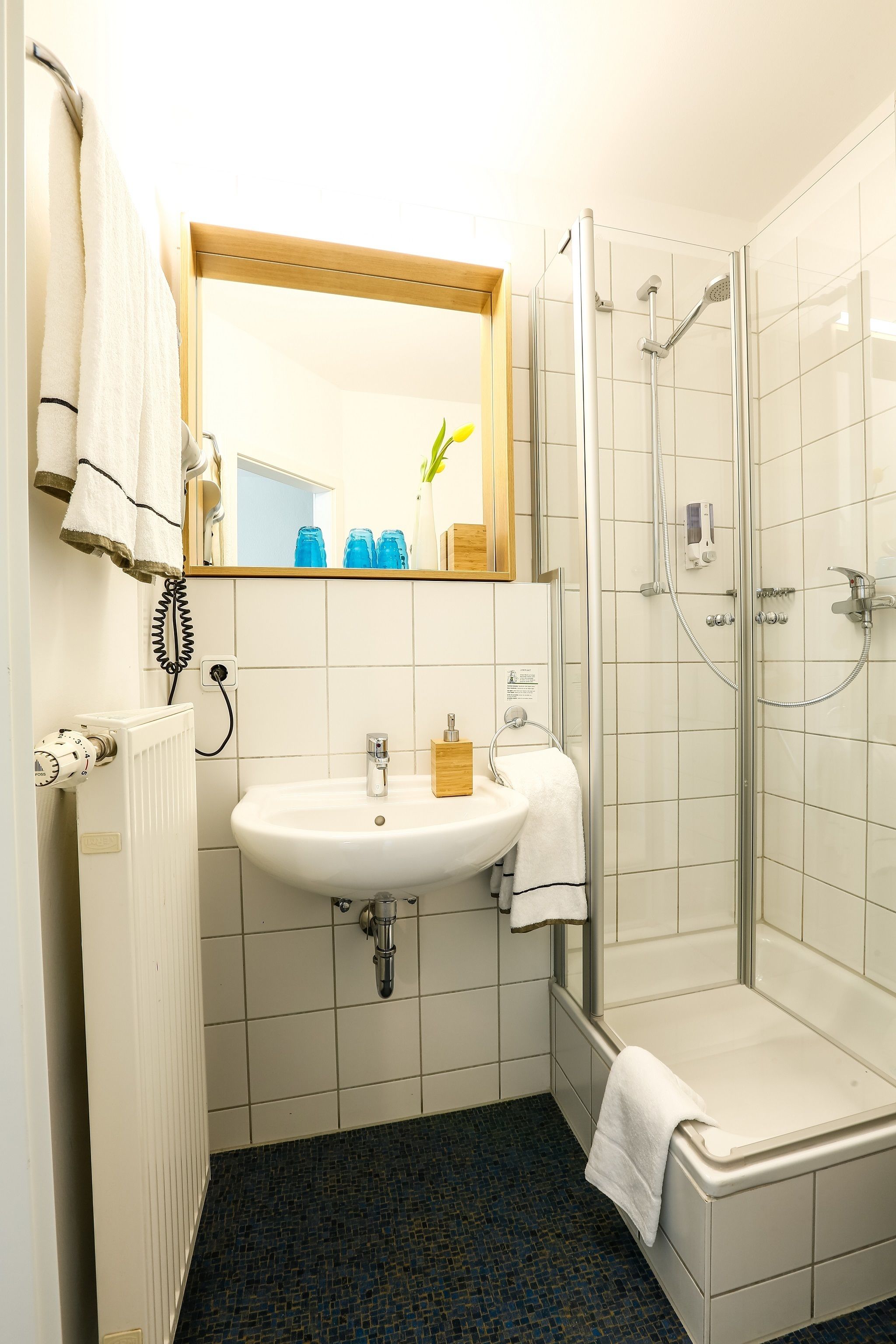 shower, eco-friendly toiletries, hair dryer, towels