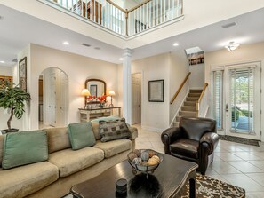 Flat-screen TV, DVD player, books, stereo