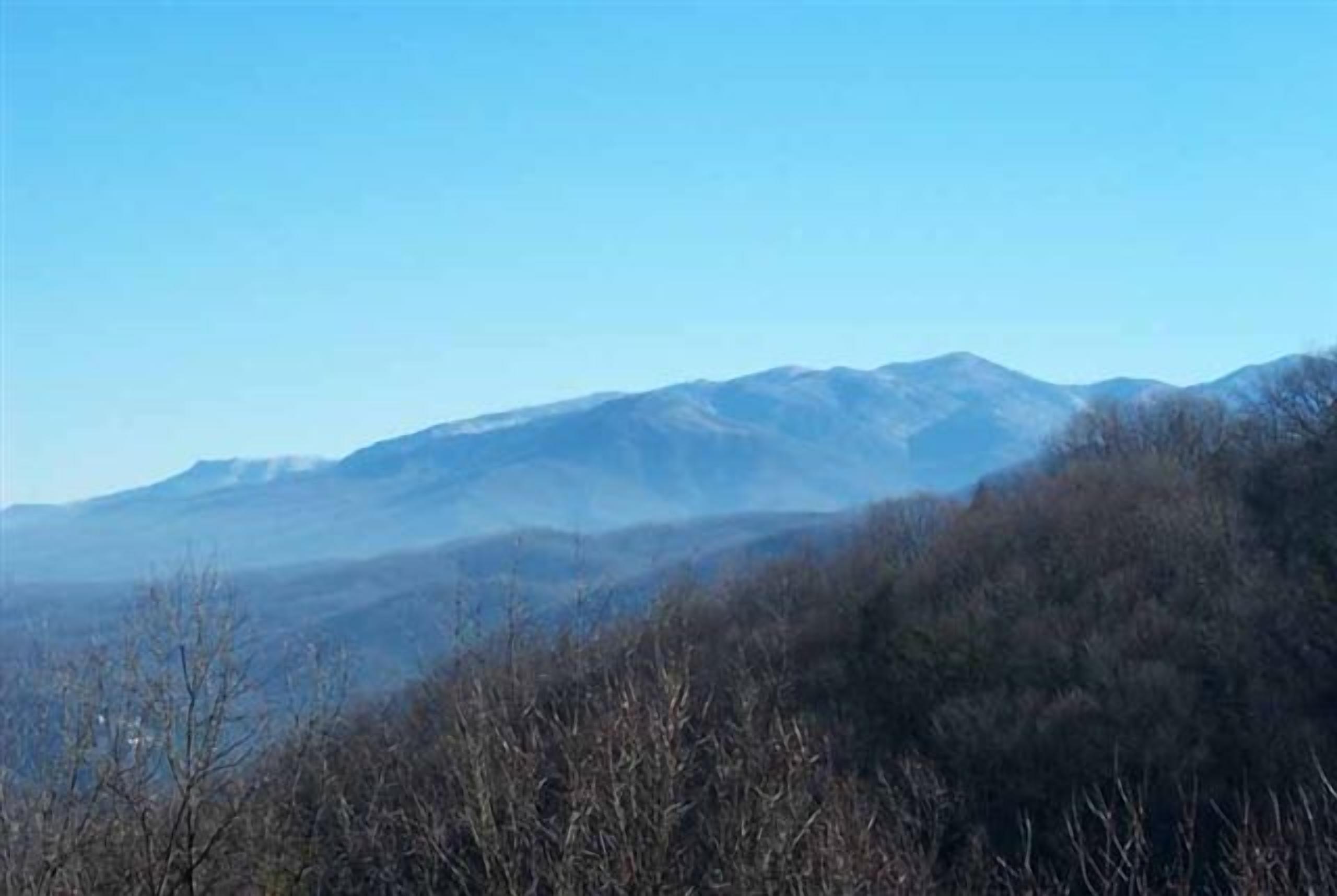A mountainous landscape with a clear sky.
