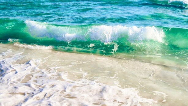 A beach with clear turquoise water and foamy waves. - (519) Paradise Found in this Stylish, high end condo. Stunning Views! (Destin)