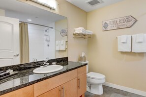 Combined shower/tub, hair dryer, towels, soap