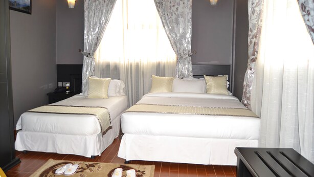 Triple Room | Desk, iron/ironing board (on request), WiFi (free) - Panone Motel K.I.A (Arusha)