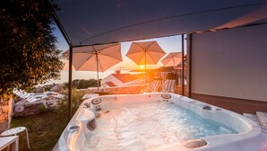 A hot tub with a view of the sunset, surrounded by umbrellas and lounge chairs. - Hacienda Babina, Island Cres, Lounge, Whirpool, Pool...Seaview (Miholascica)