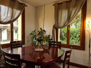 table in the corner of the lounge with views to garden