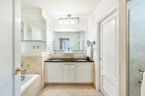 Bathtub, jetted tub, hair dryer, towels