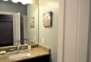 main level bathroom is shared to hallway and king bedroom, close the hallway bathroom door and this bathroom is now private to king bedroom - Vintage Advertisements Themed  luxury condo, 2 blocks from French Quarter (New Orleans)