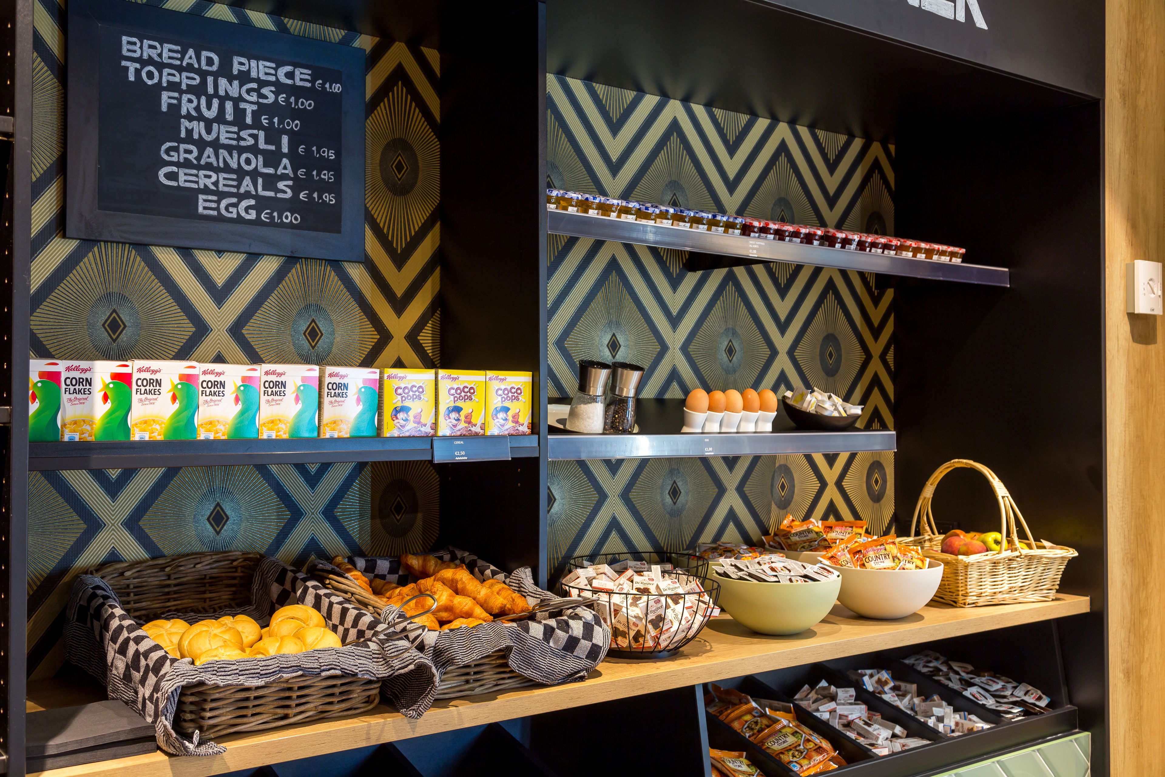 A breakfast buffet with various food items and beverages.