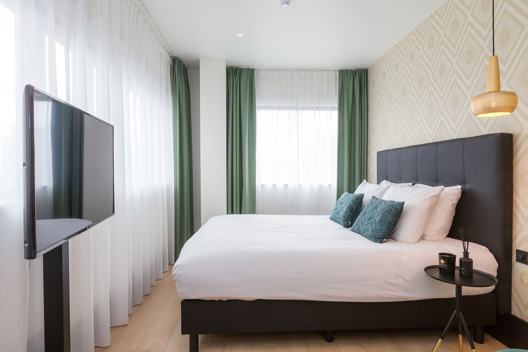 Hypoallergeen beddengoed, een minibar, een kluis op de kamer