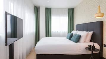 Hypoallergeen beddengoed, een minibar, een kluis op de kamer