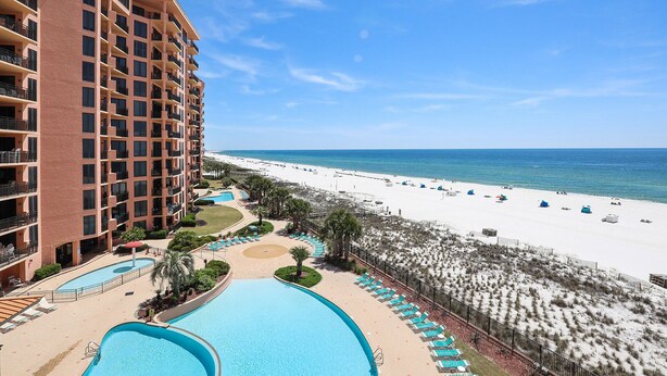 A hotel with a pool, beach, and ocean view. - 501W - Contemporary 3BR Beachfront Condo! (Orange Beach)