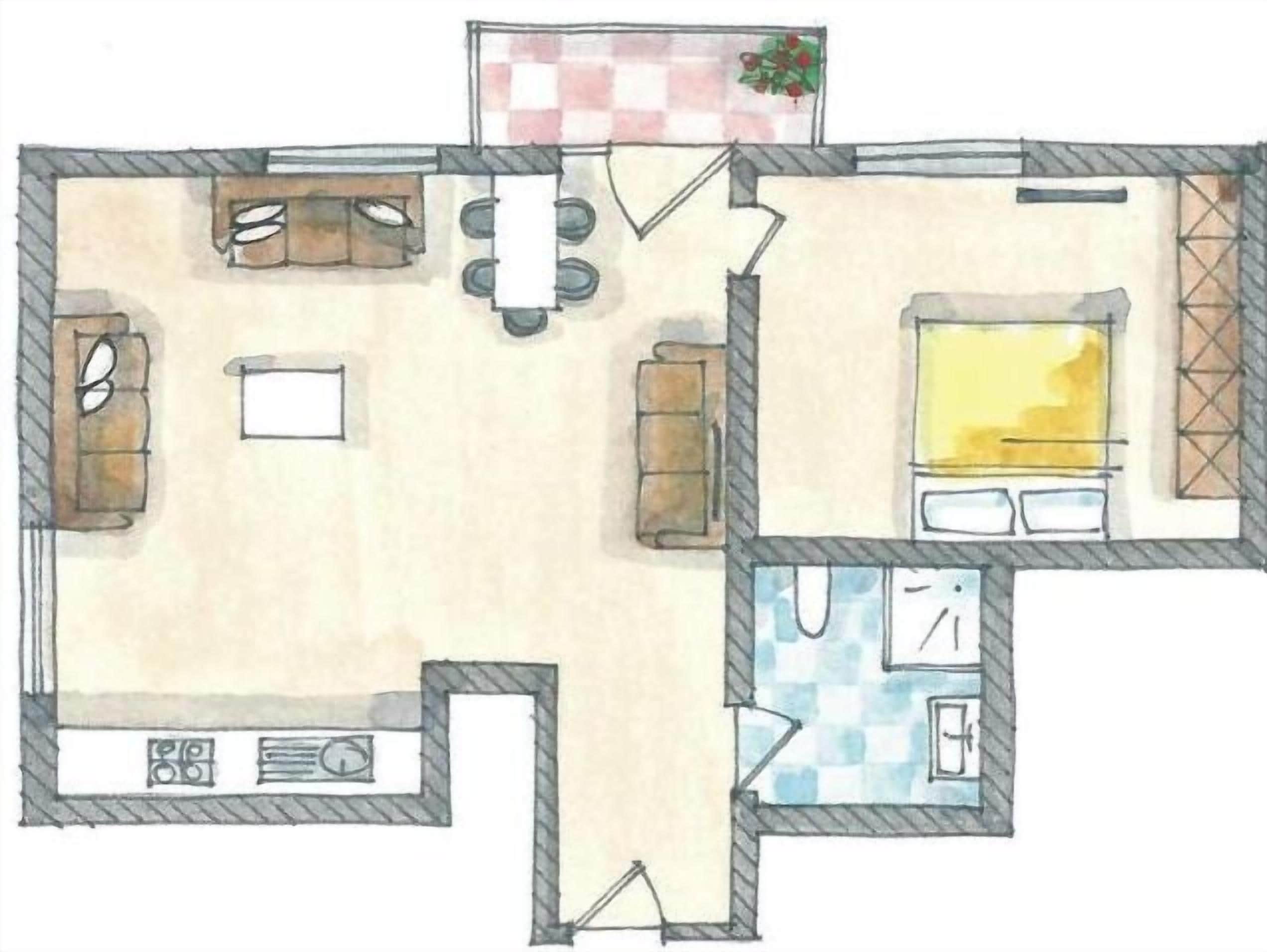 Planta baixa de um quarto de hotel com cozinha, mesa de jantar, sofá e cama.