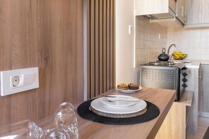Classic Studio, Balcony, Courtyard View | Private kitchen | Full-size fridge, stovetop, espresso maker, coffee/tea maker - Porto Orion Studios (Chania)