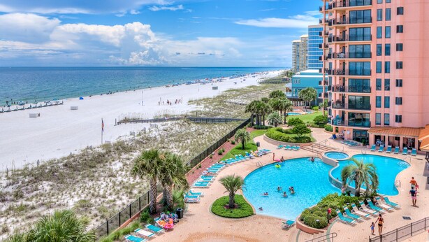 A beachfront hotel with a swimming pool, beach access, and a view of the ocean. - Stunning Gulf Front Views! Sensational Amenities! (Orange Beach)