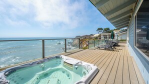 A wooden deck with a hot tub, overlooking the ocean. - Stunning, Ocean-Front Home in Seaclift Estates in Cambria! Perfection! (Cambria)