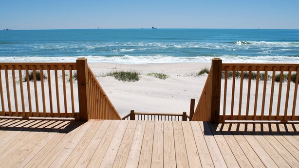 A wooden deck leading to a sandy beach with ocean views. - Sunset Blvd | Unmatched Ocean Views from private pool (Dauphin Island)