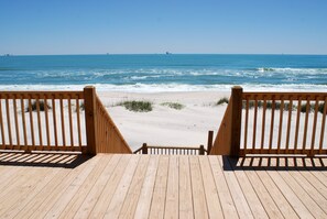 A wooden deck leading to a sandy beach with ocean views. - Sunset Blvd | Unmatched Ocean Views from private pool (Dauphin Island)